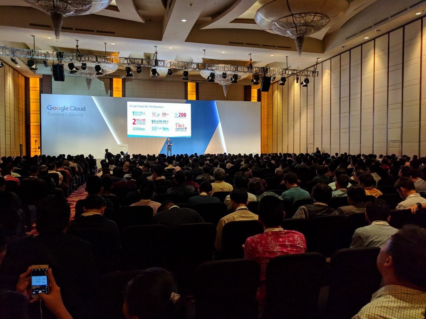 Clinton Libbey on stage at Google Cloud Summit Jakarta speaking about Google Maps and Earth